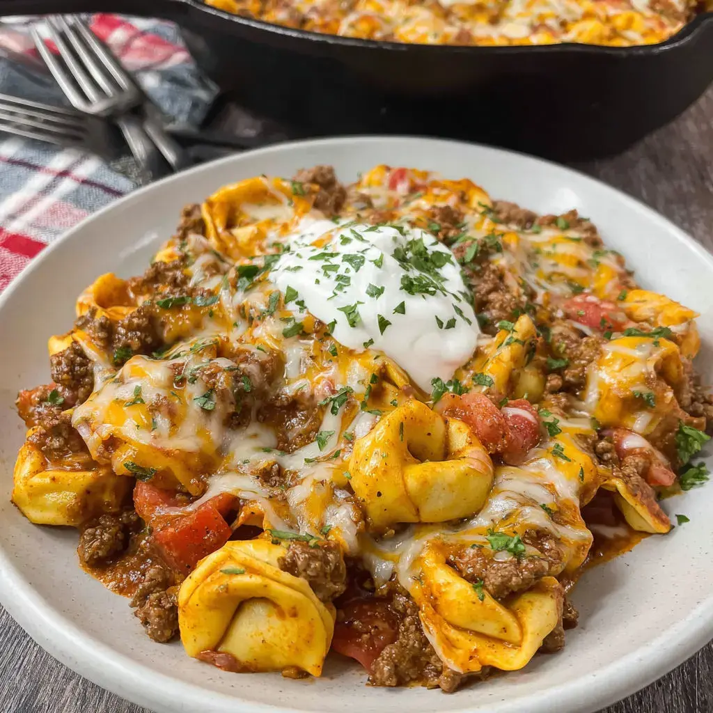 Close-up of ingredients for cheesy beef enchilada tortellini before mixing