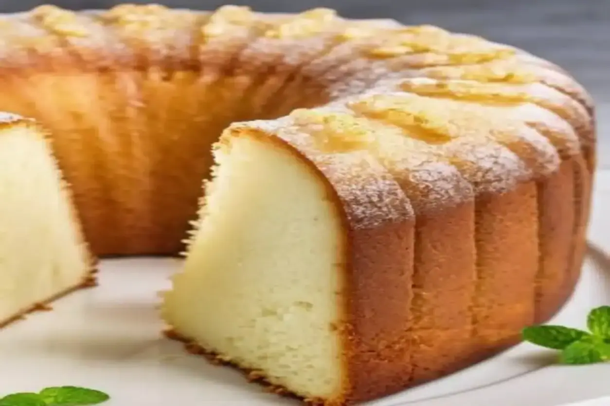 Freshly baked Lemon Lime Pound Cake cooling on a wire rack, showcasing its golden crust and moist crumb.